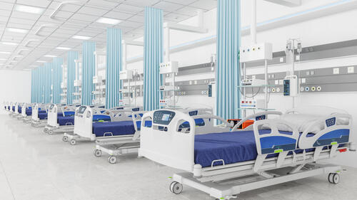 A stock image of an empty ICU unit showing medical beds.