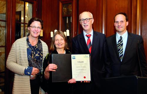Professor Alice Kuzniar stands with representatives from the Bosch Foundation.