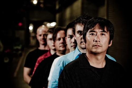 Dr. David Wang and his band Critical Mass in a publicity photo from 2007.