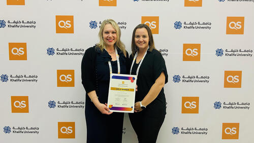 Anne-Marie Fannon, director of Waterloo’s Work Learn Institute and Carolyn Lee, educational developer, hold the Gold award certificate. 