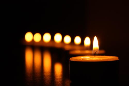 Row of candles in the dark