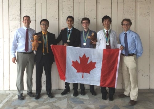 Team Canada with medals and Canadian flag at the 27th International Olympiad in Informatics in Almaty, Kazakhstan