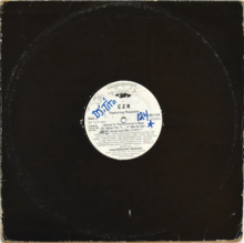 A house music 12-inch single in a cardboard sleeve with notes and doodles inked on the record's circular inside label.
