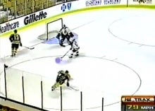 An image of a hockey game with a glowing puck circa 1996.