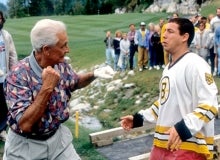 Bob Barker punches Adam Sandler in a scene from the film Happy Gilmore.