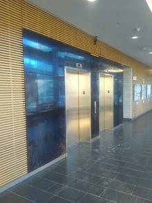The original blue-metal facade of the elevator lobby.