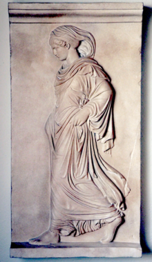 A carved bas-relief of a woman in a toga known as Gradiva.