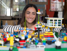 Ilana Ben-Ari in front of a lego playset.