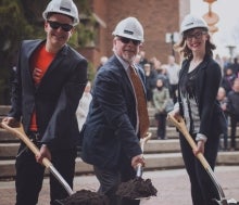 Dylan Ball (president of Arts Student Union) and Hannah Beckett (Arts Endowment Fund board member) with Dean Doug Peers.