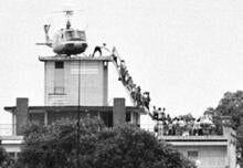An iconic photo of people being evacuated via helicopter from a rooftop during the fall of Saigon.