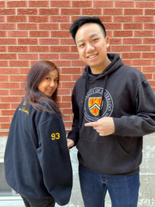 Winnie and Aaron Leung show off their Waterloo-branded sweatshirts and jackets.