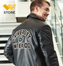 A man wearing a University of Waterloo leather jacket.