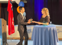 Jeremy Wang receives his Mitacs award at Fed Hall.