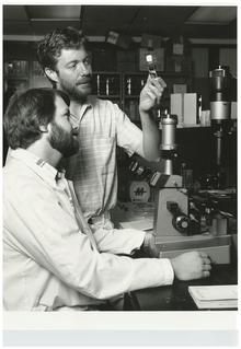 Professor Ralph Smith stands with a graduate student in a 1988 lab photo.