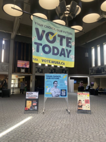 A WUSA vote banner in the Student Life Centre.