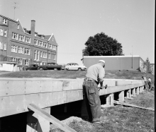 A man works on the foundation for one of the Annex buildings at Waterloo College.