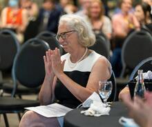 Dean Jean Andrey sits during her farewell celebration.