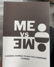 The front cover of the Me Vs. Me guided journals.