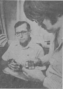 Dr. Lee Dickey and student Stephen Locke puzzle out Rubik's Cubes in a 1981 photo.