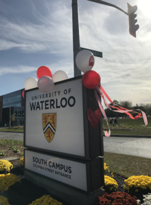 The University's north campus entrance festooned with ribbons and balloons.