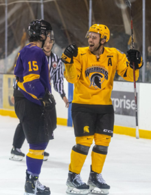 A Warrior and Golden Hawk exchange a laugh on the ice.