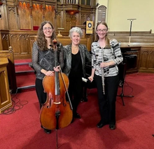 The three members of the Phoenix Trio pose with their instruments.