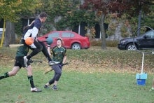 Athletes participate in a game of Quidditch.