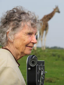 Professor Anne Innis Dagg with a giraffe.