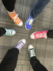 The six Deans put their Converse-sneaker'd feet forward.