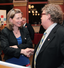 Professor Mary Wells speaks with a dignitary at a research diversity event in 2015.