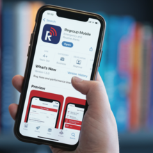 A person holds up a smartphone with the Regroup mobile app open on it.