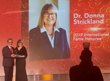 Feridun Hamdullahpur and Donna Strickland on stage together.
