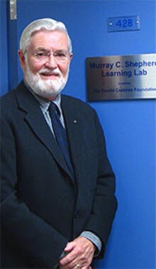 Murray Shepherd stands next to the library learning lab that bears his name in 2006.