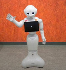 The Pepper robot with a tablet around its neck.