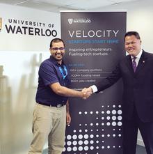 Jay Shah of Velocity shakes the hand of a Waterloo Hong Kong Foundation official.