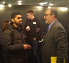 A student speaks with Feridun Hamdullahpur at the President's Pop-Up event.