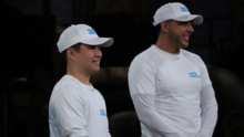 Thomas Shin and his business partner wearing Fone Guys shirts and hats
