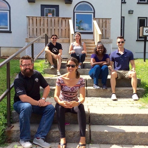 The GSA exec sitting on the steps of the Grad House.