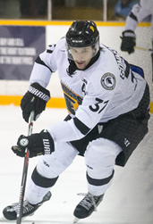 A Waterloo Warriors hockey player on the ice.