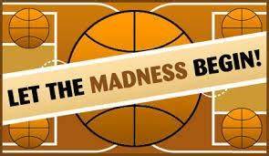 &quot;Let the Madness Begin&quot; written over a basketball court.
