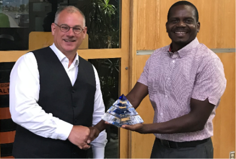 Dr. Mark Knight accepting the CNAM Pioneer award presented by Pious Maposa, CPA, CGA, MBA, Manager, Asset Planning Infrastructure Planning &amp; Policy Public Works at Halton Region.