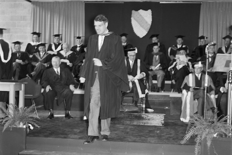 Ron Mullin in convocation regalia leaves the stage at the first convocation in 1960.