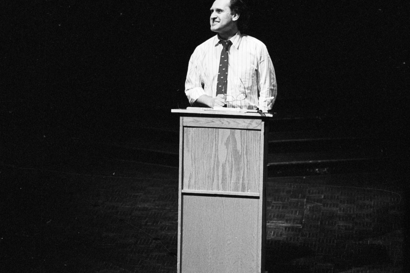 Stephen Lewis speaks at a lectern.