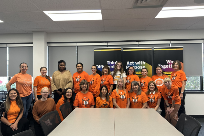 HR staff pose in orange shirts for National Day for Truth and Reconciliation