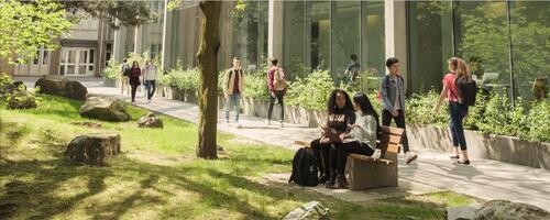 An illustration of students walking on the university campus.