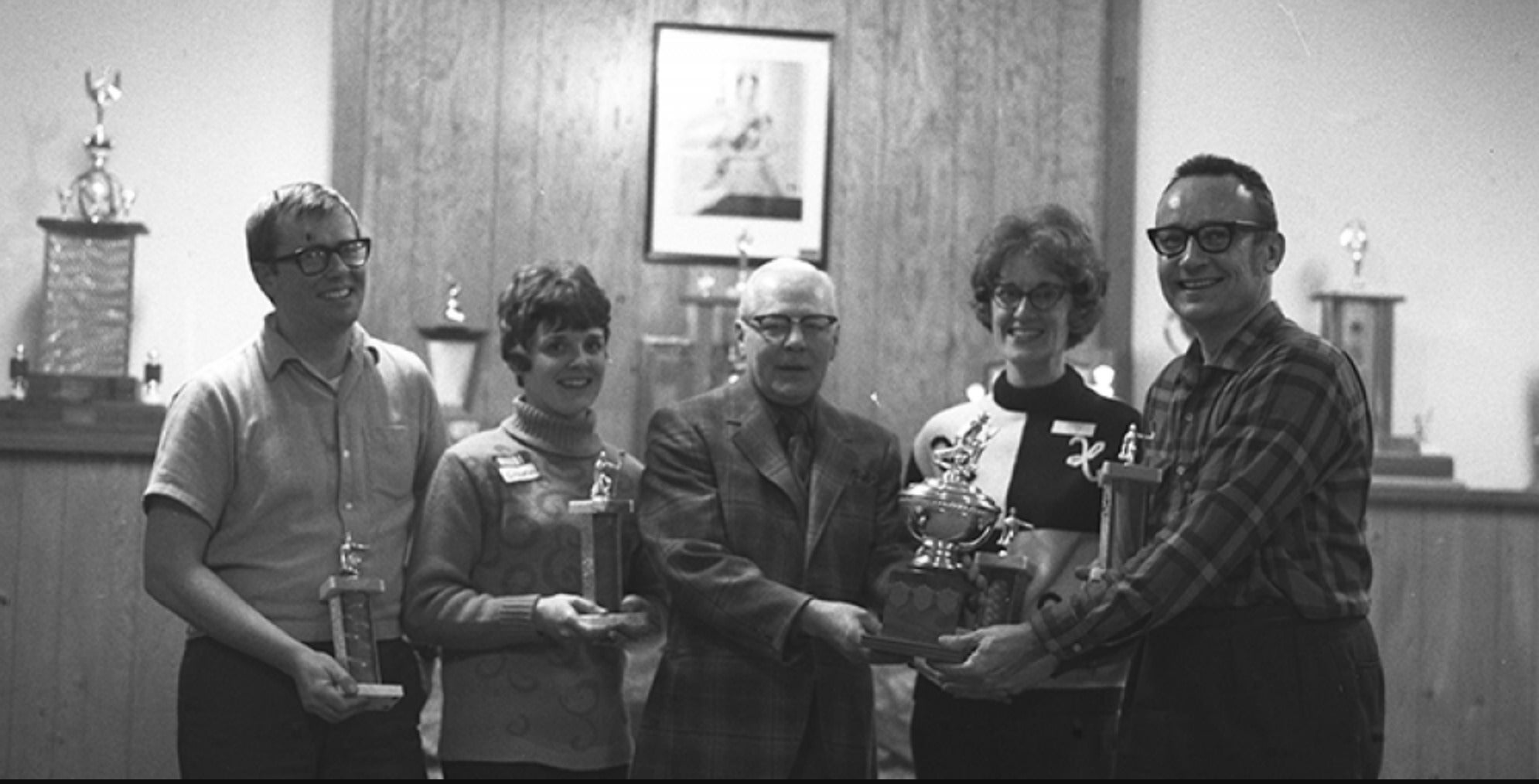 Curling funspiel participants pose with President Gerry Hagey.