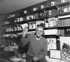 Carl Totzke poses with beer mugs from Canadian universities.