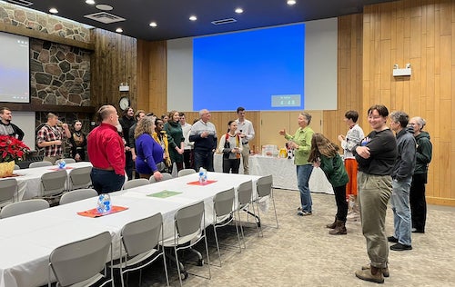 Participants in the holiday dinner in Alumni Hall at United College.