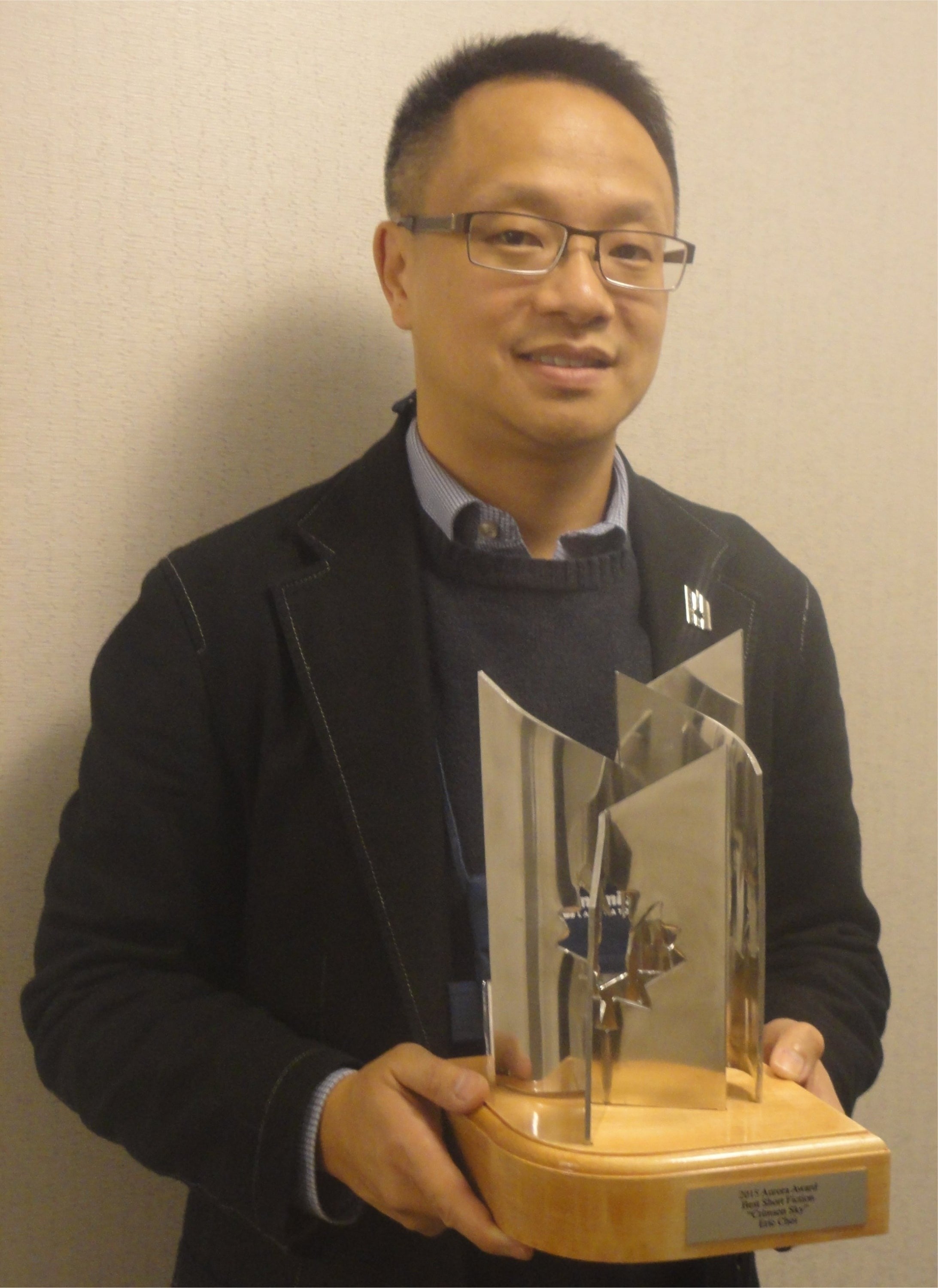 Eric Choi with the Aurora Award trophy.