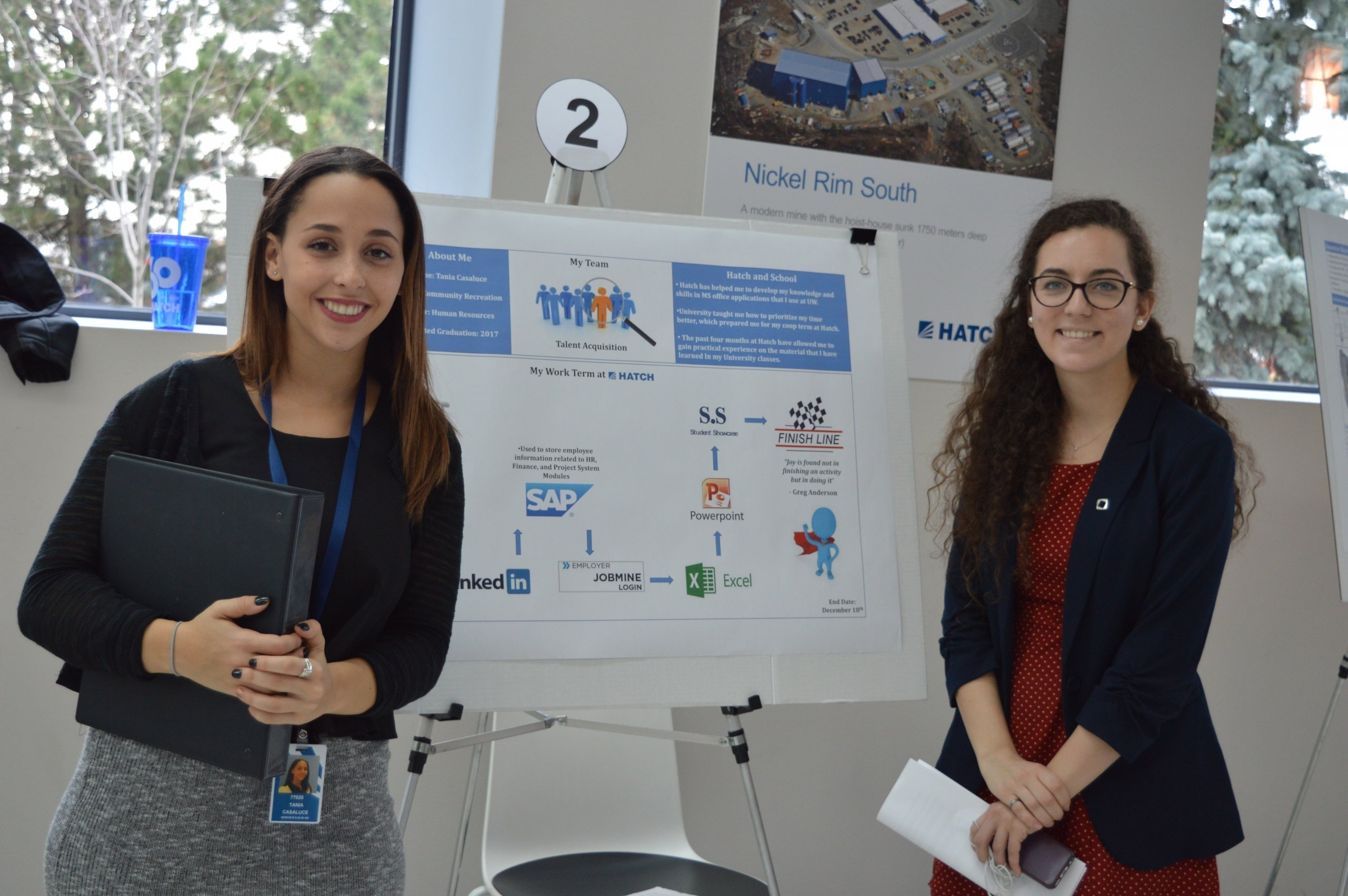 Tania Casaluce poses with her presentation and an unidentified woman.